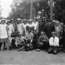 An outdoor posed group of about fifty happy people.