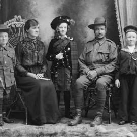 Studio portrait of the Gray family.