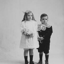 Studio full-length portrait of a young girl and boy.  Family name Rundell.