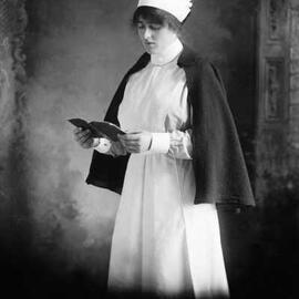Studio portrait of a woman in a nurse’s uniform.  Family name ‘Cunningham’.