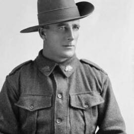 Studio portrait of a man wearing an Australian Army uniform.  Family name Winrow.