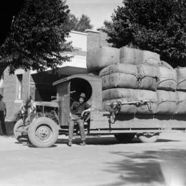 A motor lorry  loaded with wool bales.