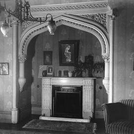 A parlour, sitting room or lounge room of an unidentified residence.