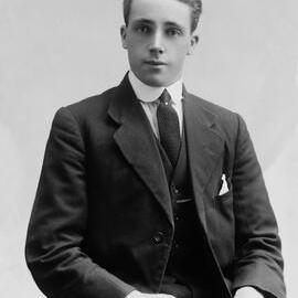 Studio portrait of a young man in a three-piece suit.  Family name possibly Robertson.