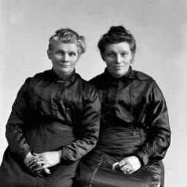 Studio portrait of two woman.  Family names Kirby and Horrigan.