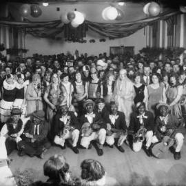 A fancy dress group with minstrels at an unknown function, possibly in Benalla.