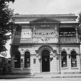 National Bank of Australasia Limited premises in Benalla adorned with flags of many nations.