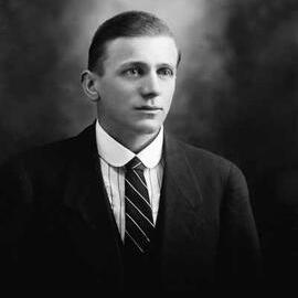 Studio portrait of Mr. Jennings wearing a suit.