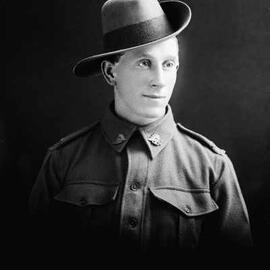Studio portrait of a man in an Australian Army uniform.  Family name Bone.