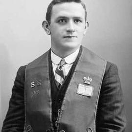 Portrait of a young man wearing an embroidered vest.  Family name Payne.