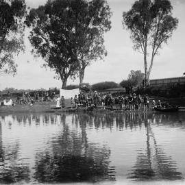 A swimming event at a river.