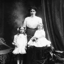 Portrait of a woman and two young girls.  Family name Bryne.