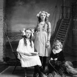 Studio portrait of three girls.  Family name Gibson.
