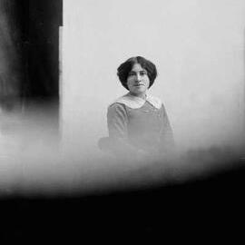 Studio portrait of a young woman wearing a lace collar.  Family name Allan.