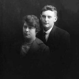 Studio portrait of a man and a woman.   Family name Walsh.