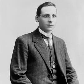 Studio portrait of a young man wearing a three piece suit.  Family name possibly Oldfield.