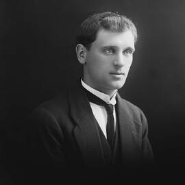 Studio portrait of a young man in a three-piece suit.  Family name possibly Fletcher.