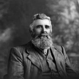 Studio portrait of Mr. Hopkins wearing a suit.