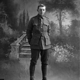Studio portrait of a young man in an Australian Army uniform.  Family name Stewart.