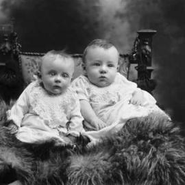 Studio portrait of two babies.  Family name Greenwood.