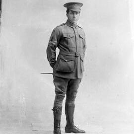 Studio portrait of an unknown man in an Australian Army uniform.