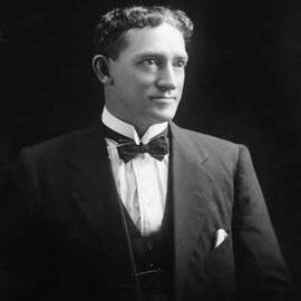 Studio portrait of Mr. Doyle wearing a suit.