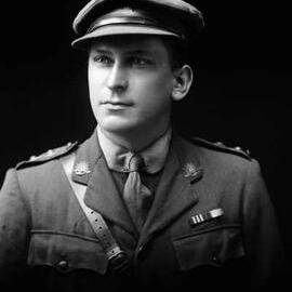 Studio portrait of a man wearing an Australian Army uniform.  Family name Seaton.