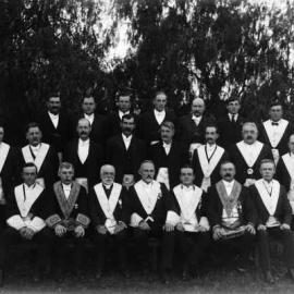A posed group of men in Masonic regalia.
