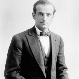 Studio portrait of a young man wearing a bow tie.  Family name possibly Ludwig.