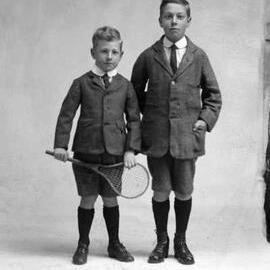 Studio portrait of two boys in suits.  Family name possibly Davidson.