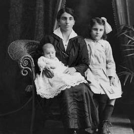Studio portrait of a woman and two children.  Family name Winrow.
