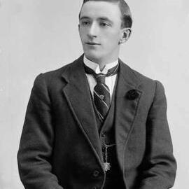 Studio portrait of a young man.  Family name Buckland.