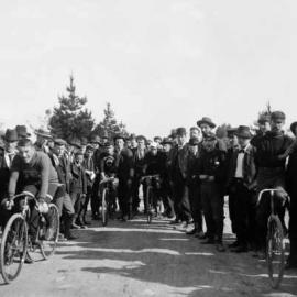 Four cyclists with supporters and onlookers at Benalla.