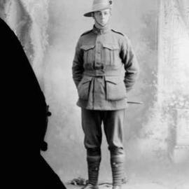 Studio portrait of a man in an Australian Army uniform.  Family name possibly Shepherd.