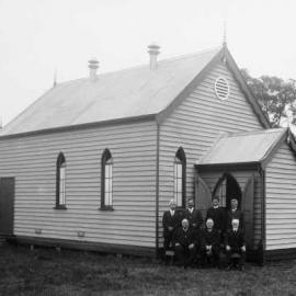 An unidentified small timber church in a rural environment.