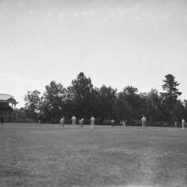 Men playing a cricket match on the Cricket Oval at Benalla.