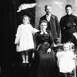 Studio portrait of a family group.  Family name possibly Sherwill.
