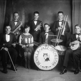 A posed group of musicians of the Benalla Jazz Orchestra with their instruments.
