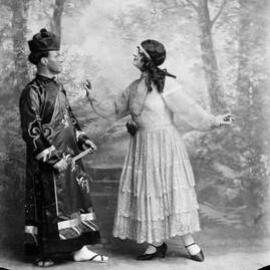 Unidentified man and woman in acting poses.