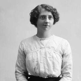 Studio portrait of  a young woman with spectacles.