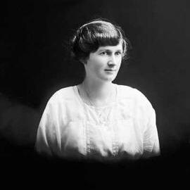 Studio portrait of a young woman in a white blouse.  Family name Irvine.