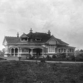 A large brick Edwardian single story home with an extensive garden.