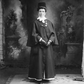 Portrait of Miss [or Mrs.] Moore wearinga nurses outdoor uniform.