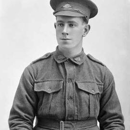 Studio portrait of a young man in an Australian Army uniform.  Family name Hicks.