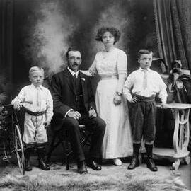 Studio portrait of a family group.  Name possibly Brien.