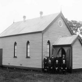 An unidentified small timber church in a rural environment.
