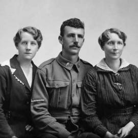 Portrait of two women with a man wearing an Australian Army uniform.  Family name Hamilton.
