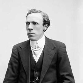 Studio half-length portrait of Mr. McKennie.