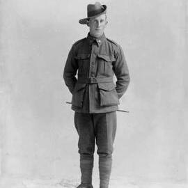 Studio portrait of a young man in an Australian Army uniform.  Family name Bone.