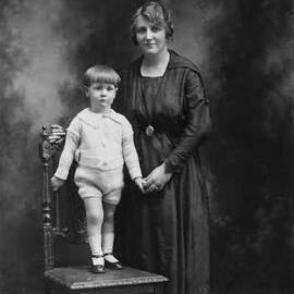 Studio portrait of a woman and a small boy.  Family name Gleeson.